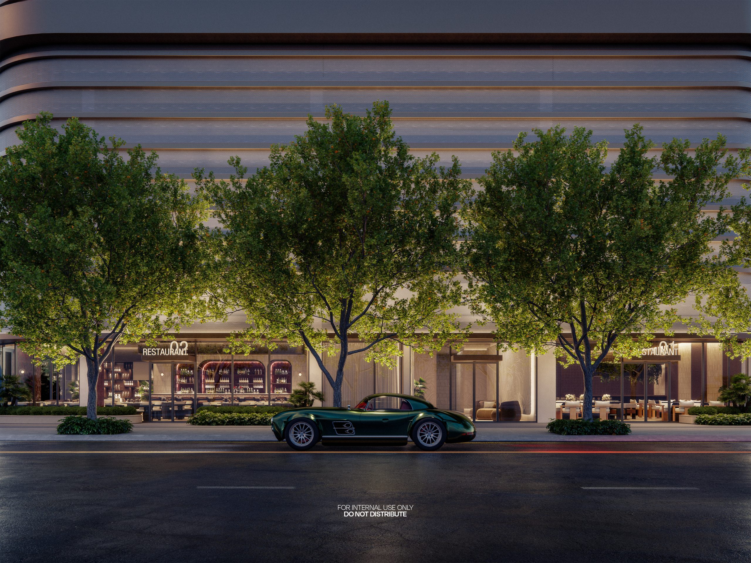 Modern commercial office building exterior illuminated at dusk with landscaped frontage.