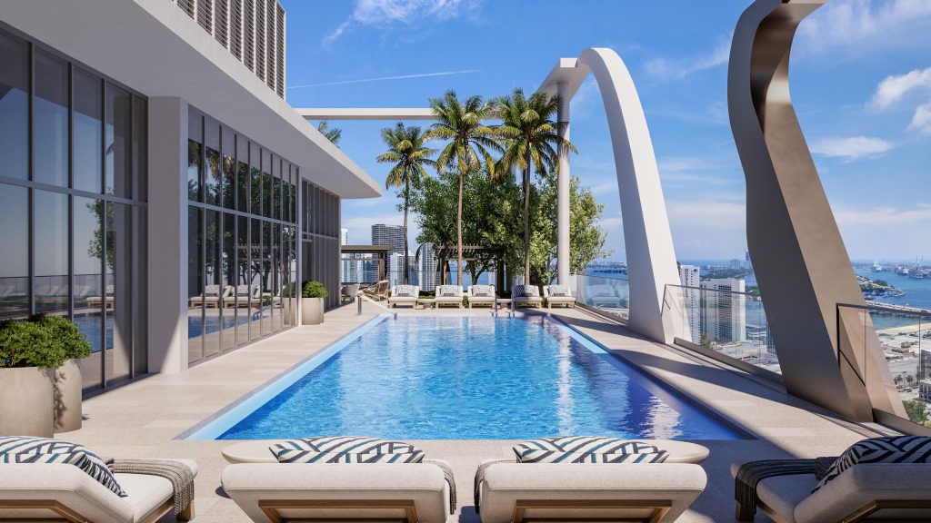 Luxury rooftop pool deck with lounge chairs and city skyline views.