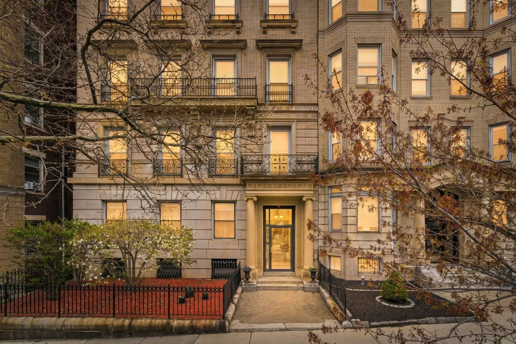 Historic apartment building with a well-maintained entrance and classic architectural details, symbolizing professional legal guidance in real estate transactions.