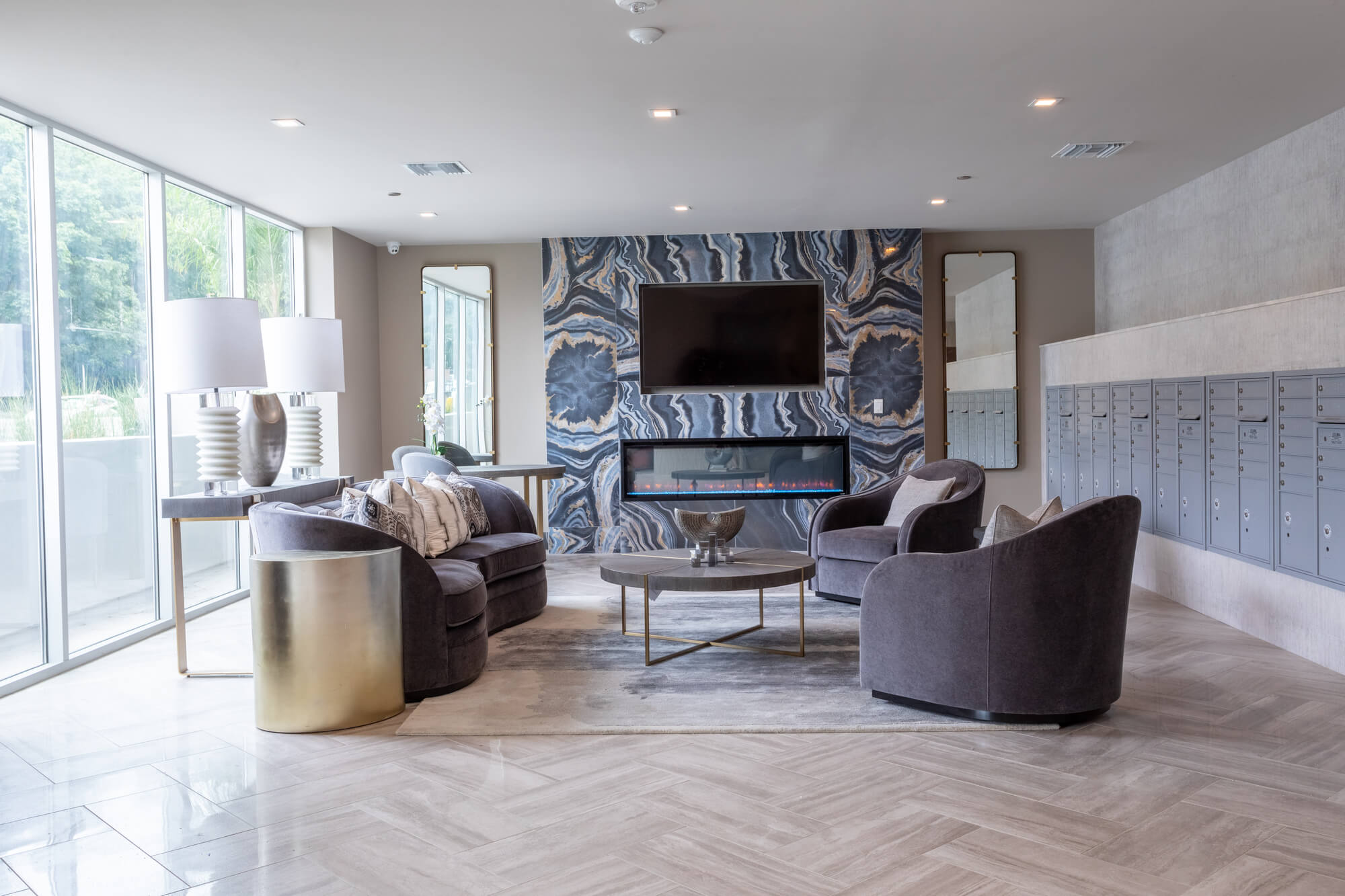 Elegant apartment community lobby featuring lounge seating, modern finishes, and a welcoming gathering space.