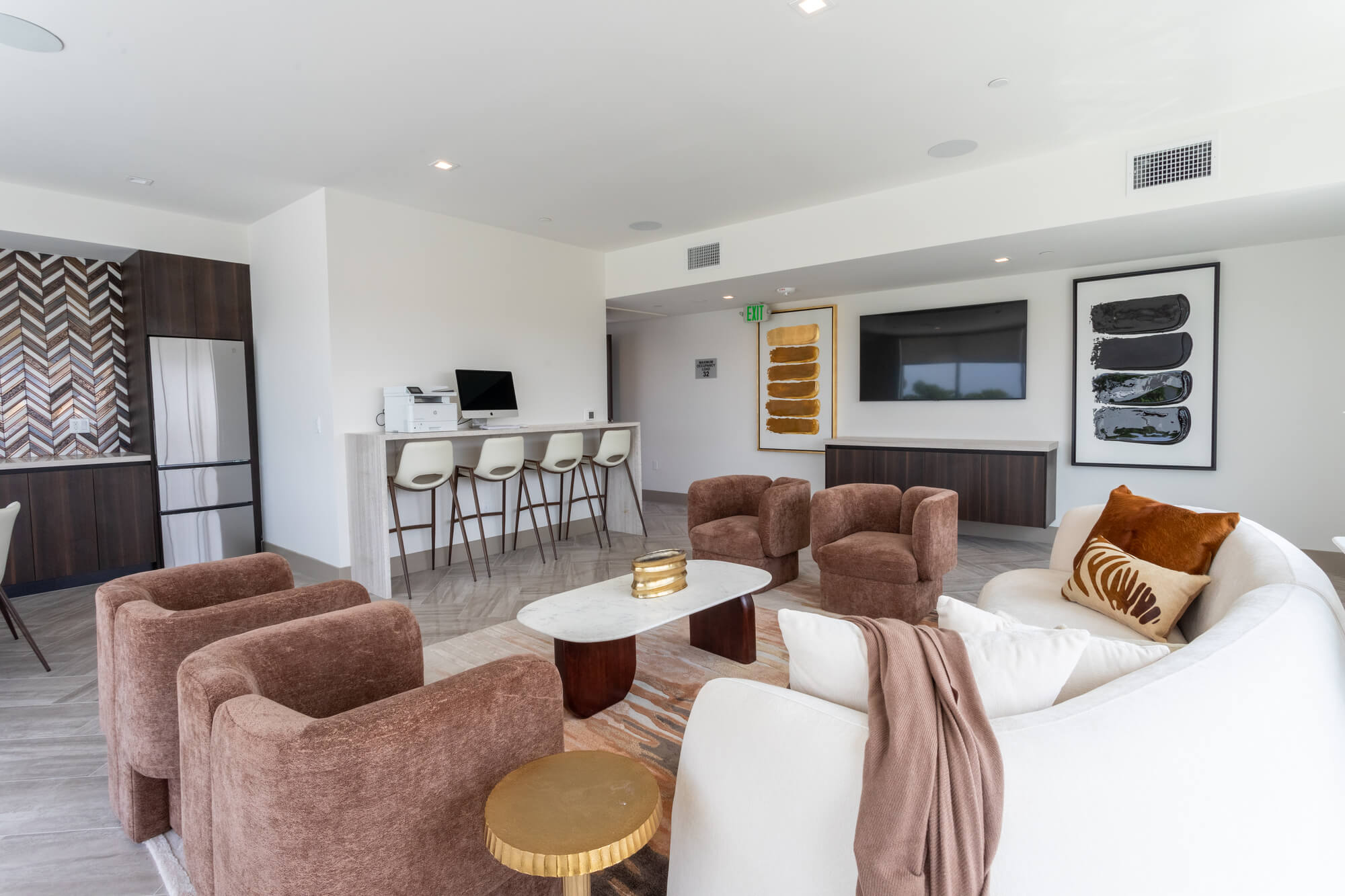 Stylish resident lounge with comfortable seating, contemporary décor, and open communal spaces for socializing and relaxation.