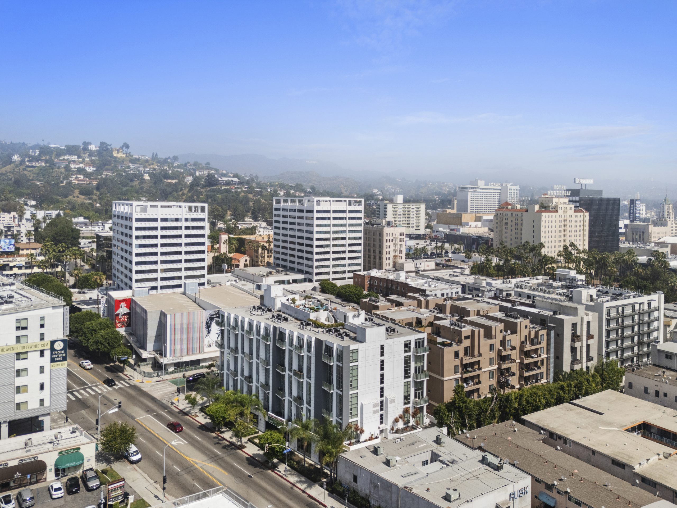 Aerial view of multi-dwelling residential buildings in dense urban neighborhood.