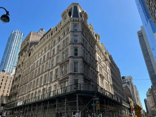 Historic downtown apartment building exterior with classic architectural detailing.