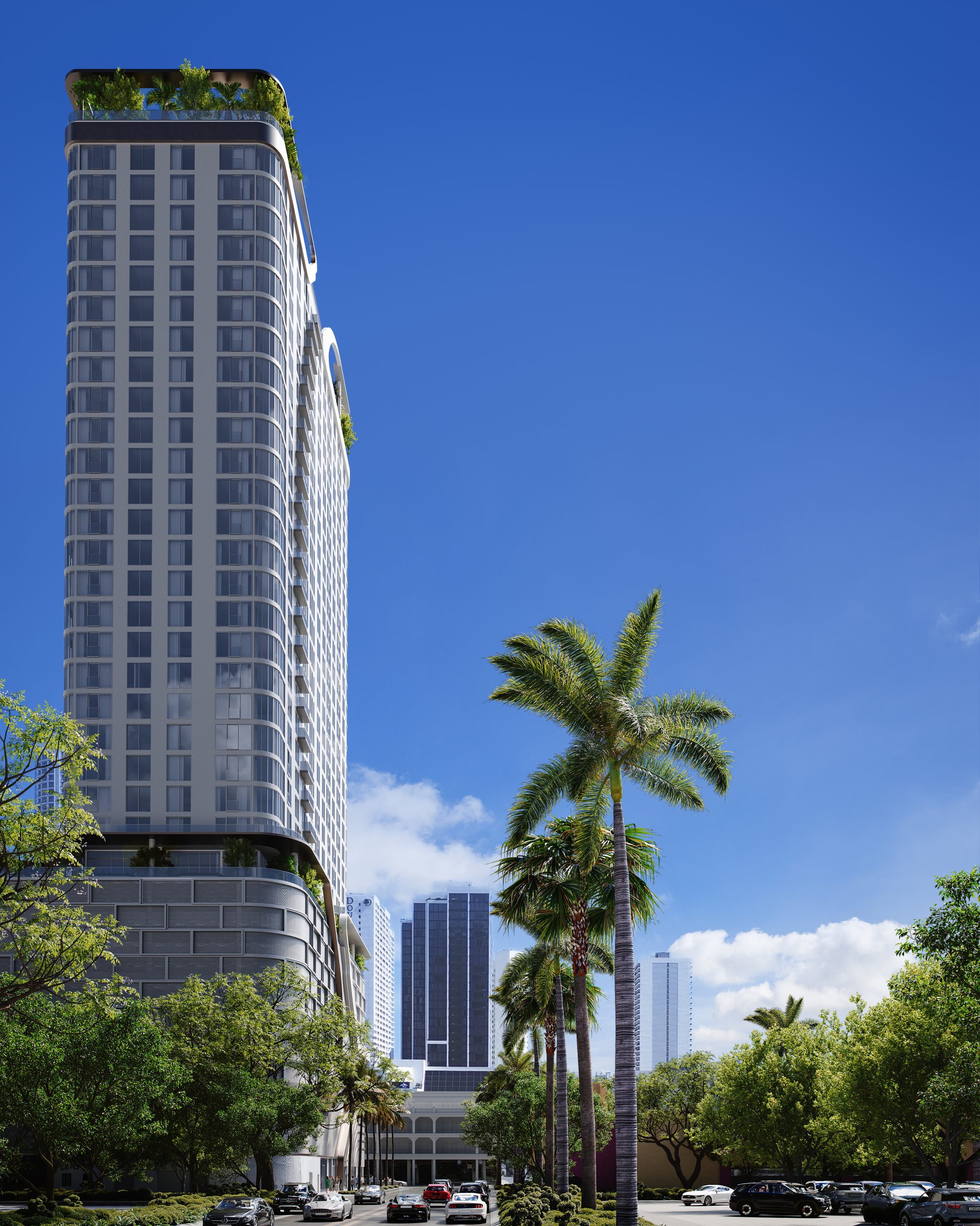 Modern high-rise multifamily residential tower with palm trees and city skyline.
