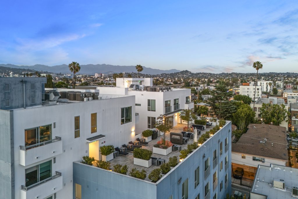 Modern property rehabilitation project with rooftop terraces and contemporary architecture.