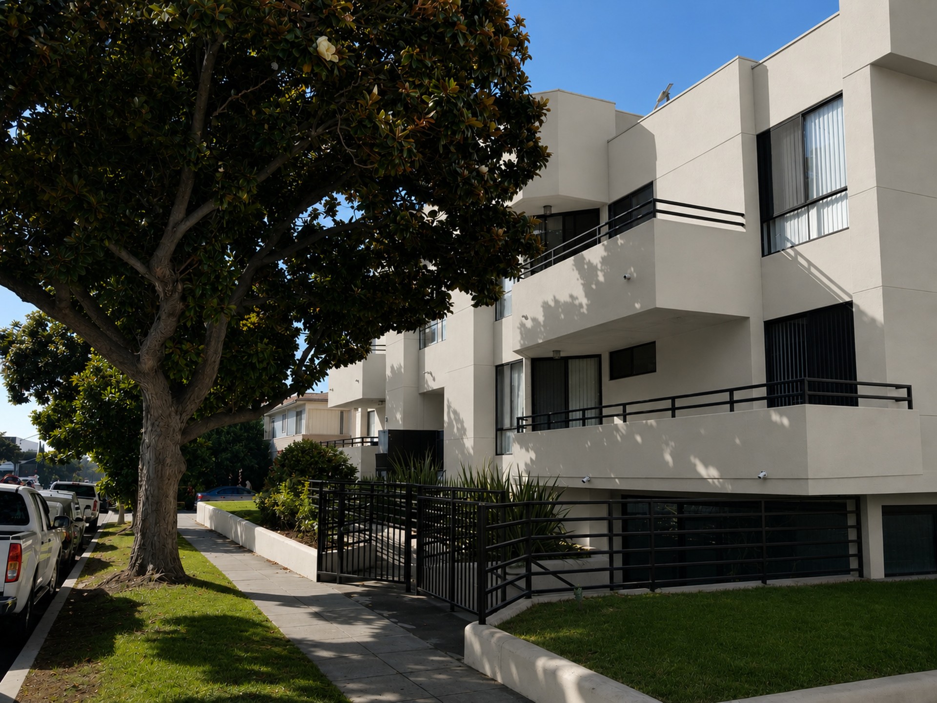 Luxury townhouse-style multifamily residences with modern black-and-white exterior design.