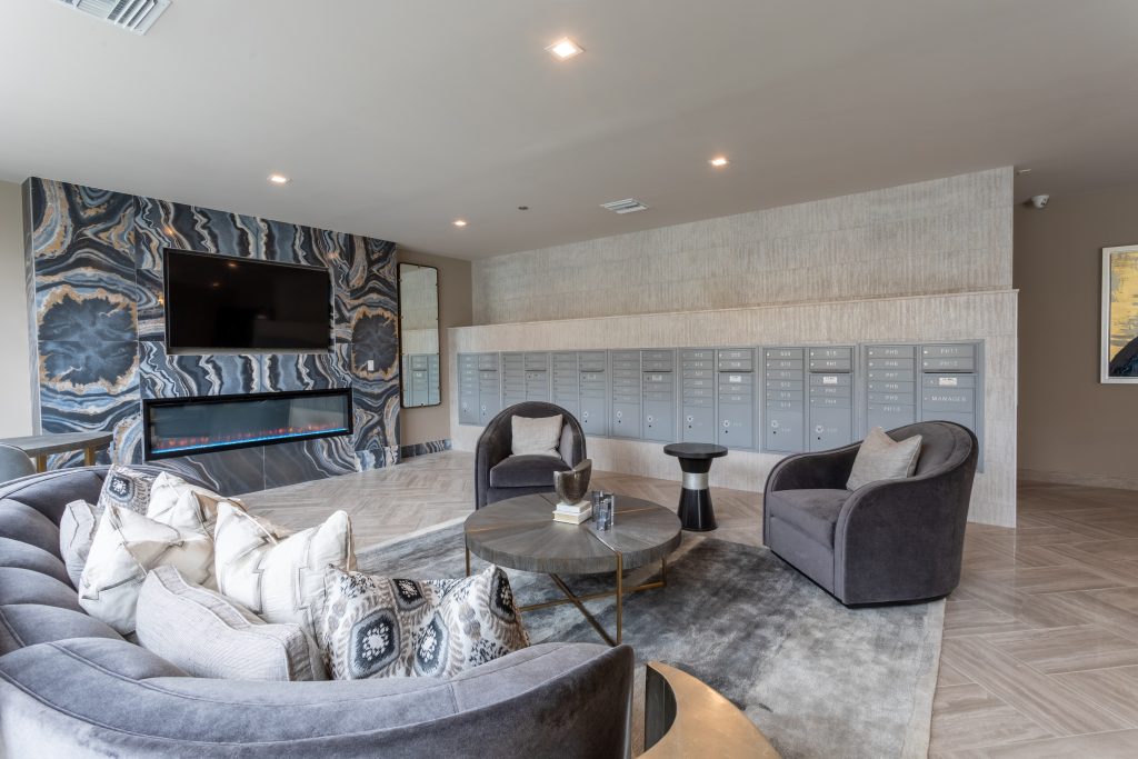 High-end apartment clubhouse lounge with contemporary seating and luxury interior finishes.